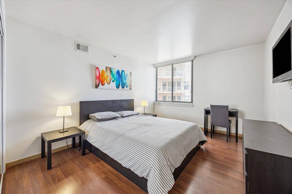 The secondary bedroom is located at the front, just off the foyer.