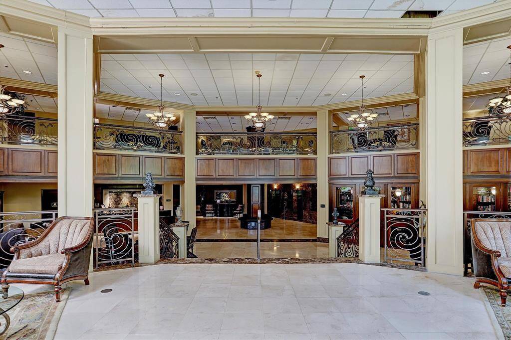 Fob-secured lobby entry leads to a lounge area, 24/7 concierge, library, work space, gym, and pool access.