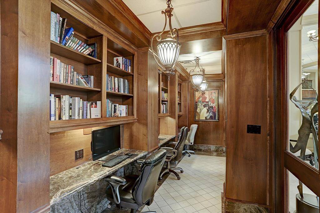 Off the lobby is a library with a computer workstation.