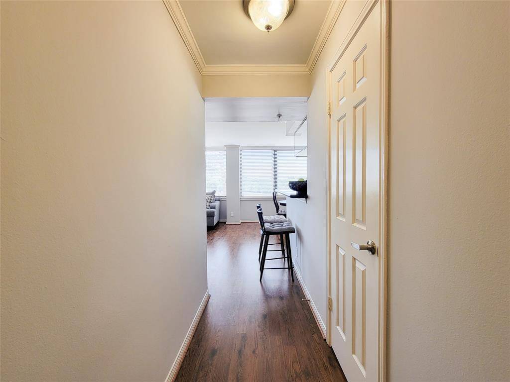 Looking down the hallway to the living area of the unit.