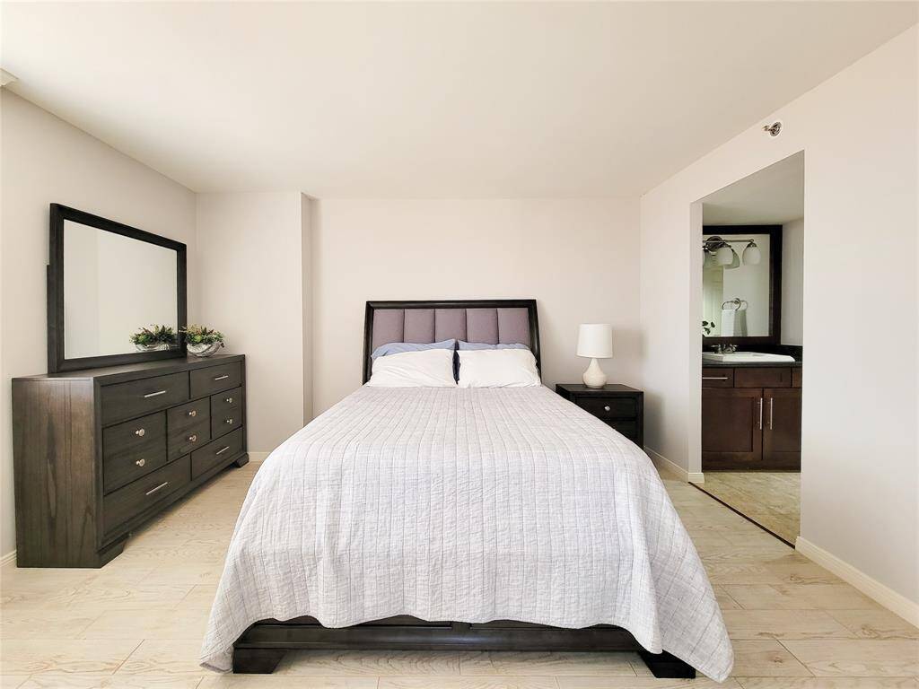 Spacious bedroom, with dressing area to the right.