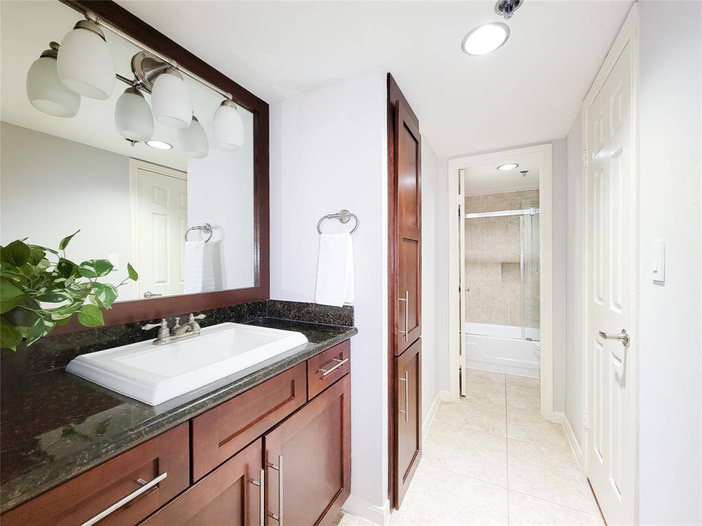 Vanity, linen closet and large walk-in closet. Toilets in both baths have been replaced.