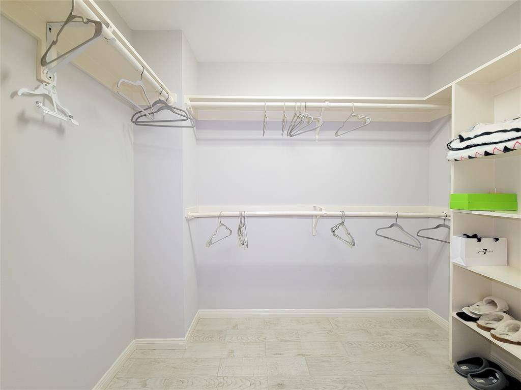 Walk-in Primary closet! Ceramic tile floor, shelving unit built-in.