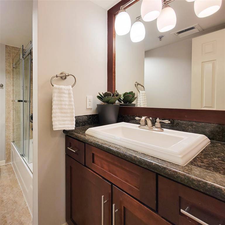 2nd bath vanity area, mirrored, lighted and storage in the vanity.