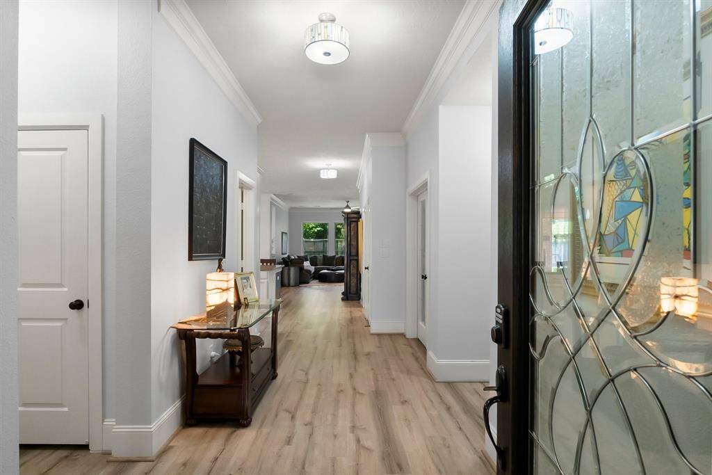 from front door, secondary bedrooms and bath on left, study on right