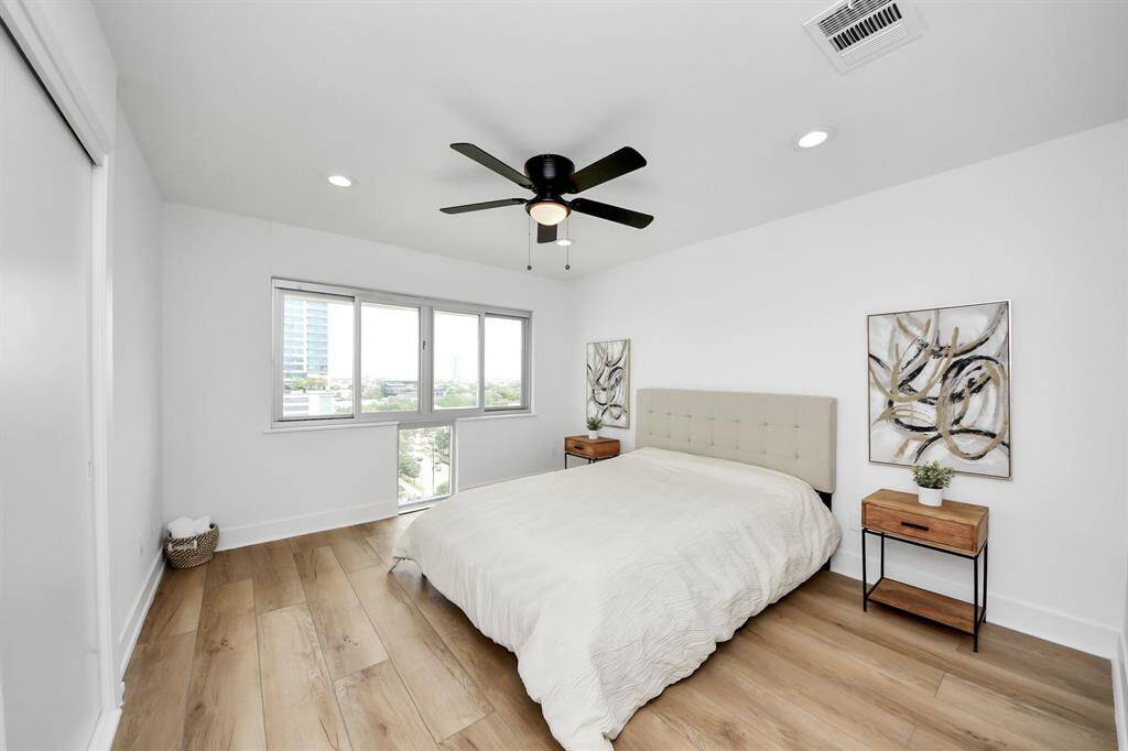 The bedroom offers generous space, large windows with great views of the neighborhood, and is flooded with natural light throughout the day.