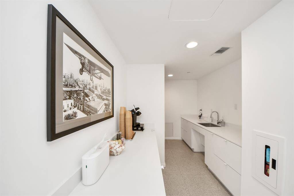 Here’s another resident area, complete with a coffee station and a mini kitchen—perfect for prepping snacks and drinks for gatherings.