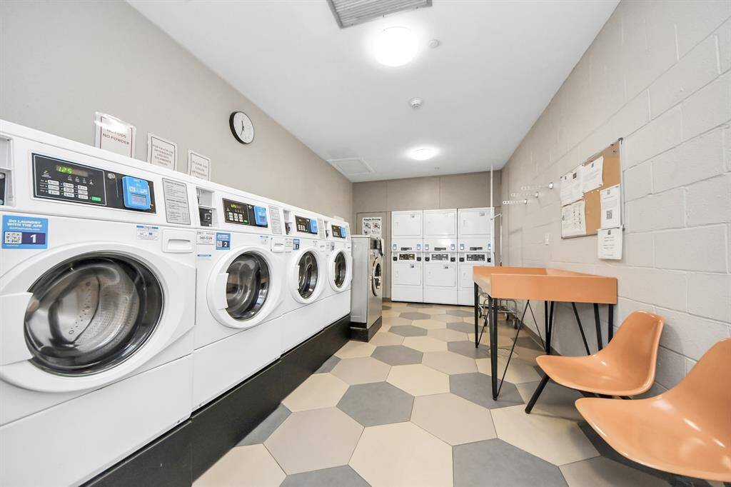 Residents’ laundry area features high-capacity front-loading washers and dryers.