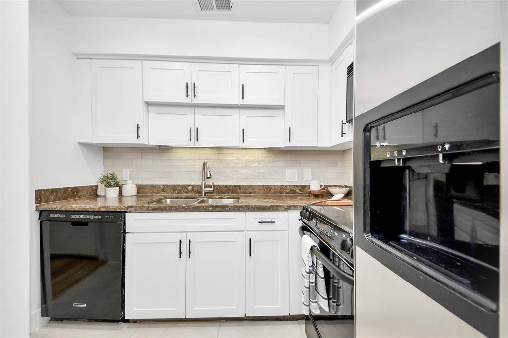 The kitchen has plenty of storage.
