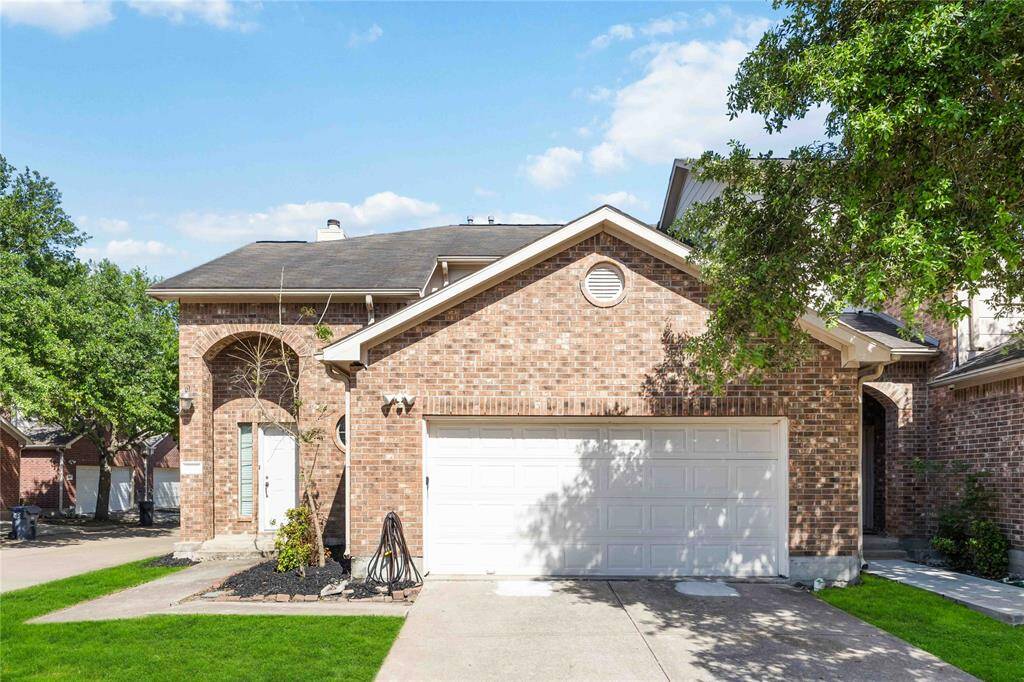 A charming brick facade welcomes you to 3703 Ashford Villa Lane. Tranquil and inviting