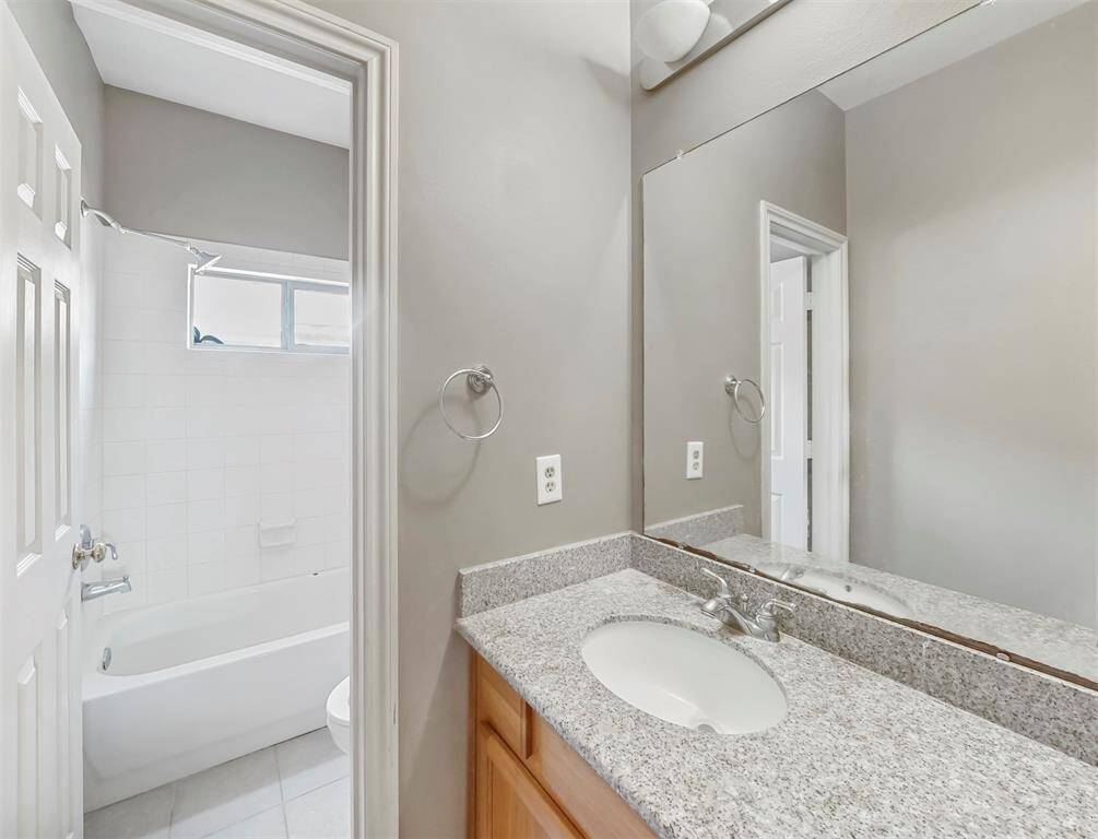 This bathroom seamlessly combines modern design starting with the spacious vanity area, bathtub and shower.
