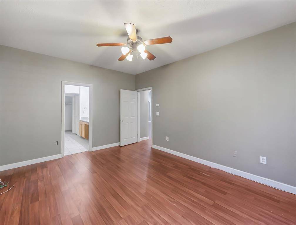 Spacious and inviting. This bedroom boasts a tranquil ambiance, ideal for rest and rejuvenation.