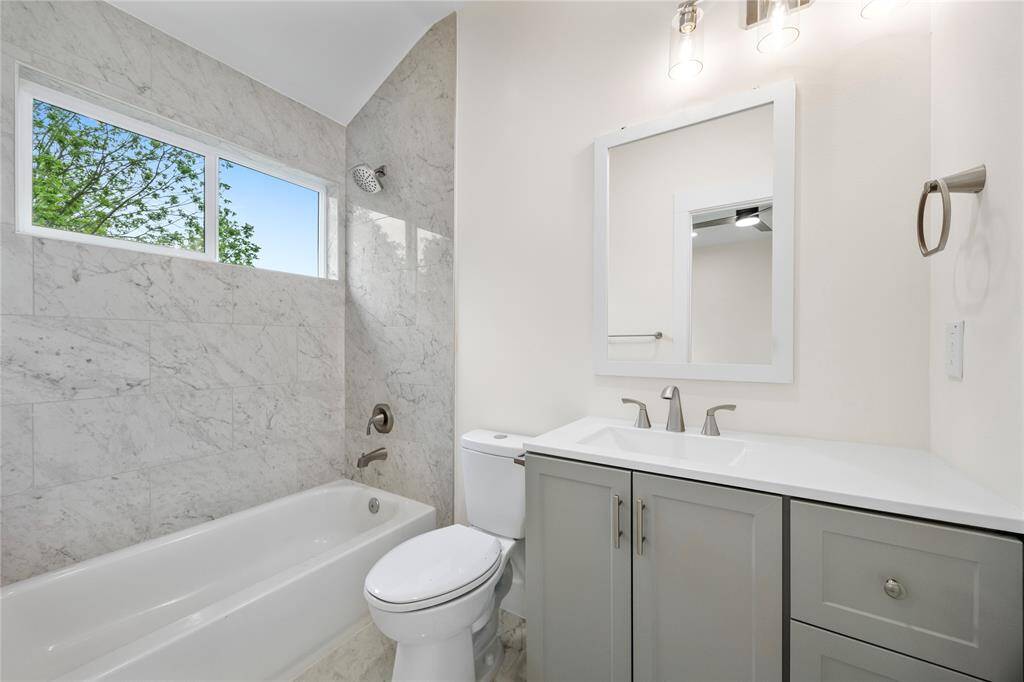 3rd bathroom natural light window dual shower and tub