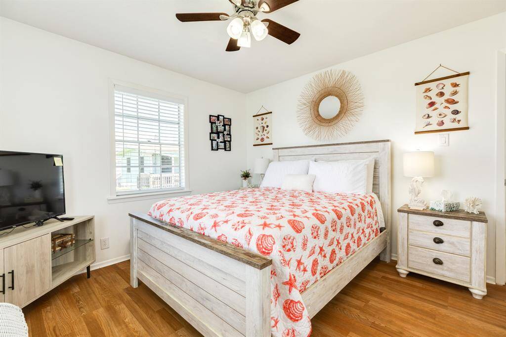 Guest bedroom with natural light and playful seashell decor.