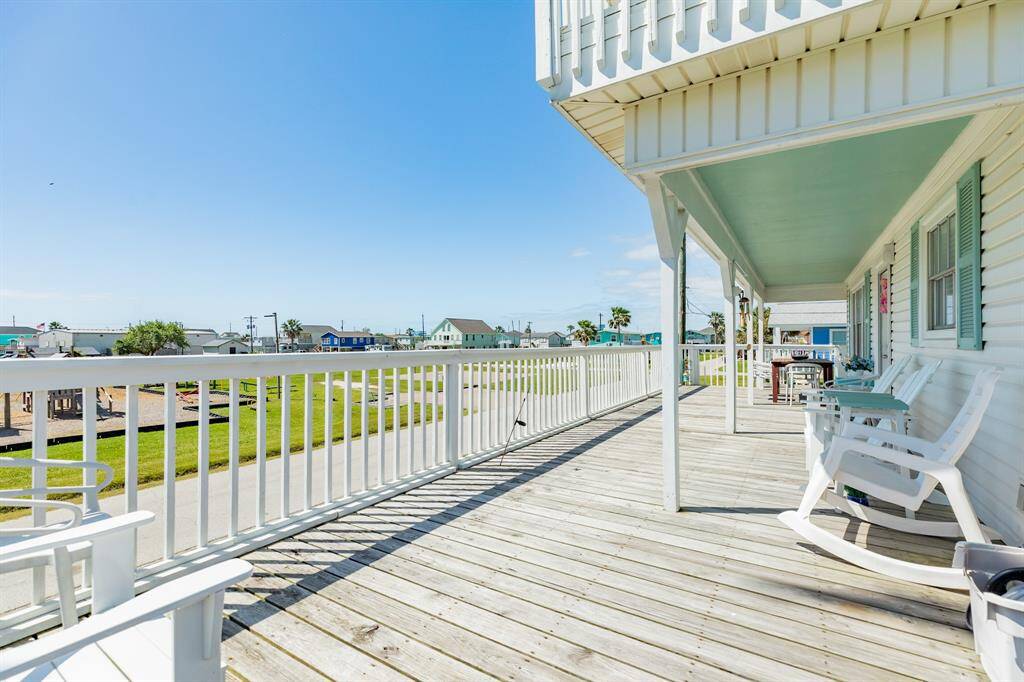 Rocking chairs and laid-back views—this deck offers direct views of the park across the street, creating a front-row seat to community charm and outdoor fun.