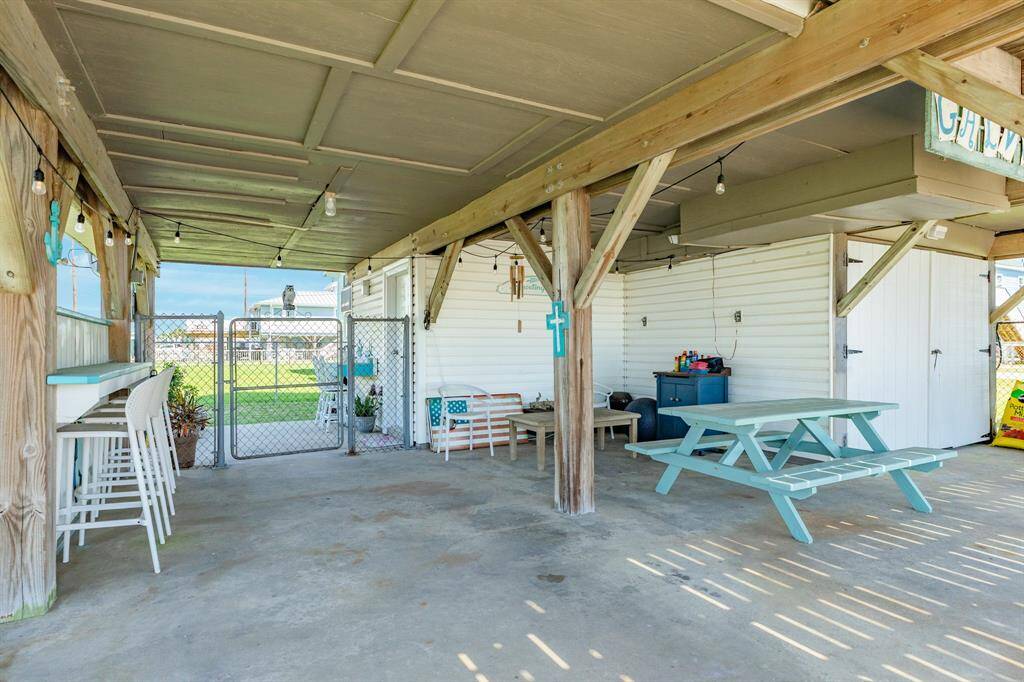 A shaded hangout zone perfect for grilling, games, or gathering with friends. Equipped with seating, a picnic table, and string lights, it’s the ultimate spot to relax after a beach day.