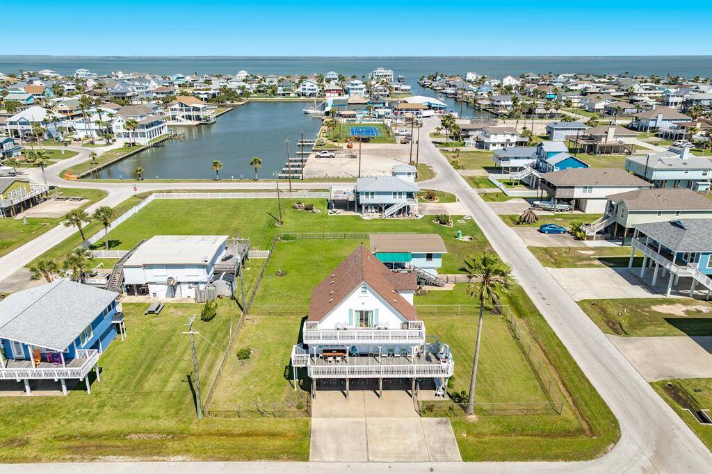Highlighted with a red arrow, this home sits across from the neighborhood park and just a few blocks from the beach, offering a prime location within a friendly and walkable community.