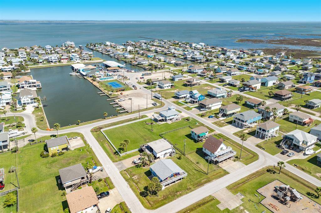 This expansive aerial view puts the home in context with all Sea Isle has to offer—proximity to the bay, boat launch, restaurant, and more.