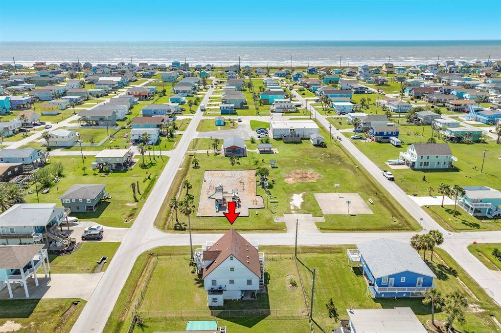 Outlined in red, this photo shows the generous corner lot and fenced yard—ideal for pets, play, or future outdoor enhancements.