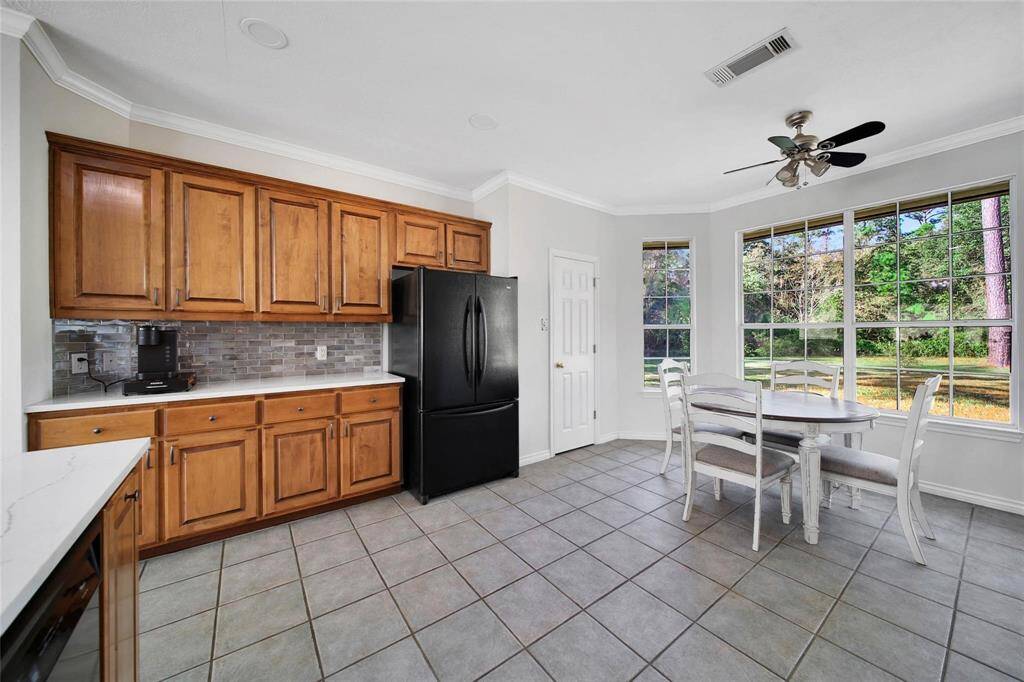 Enjoy your morning coffee at the breakfast nook with beautiful bay windows.