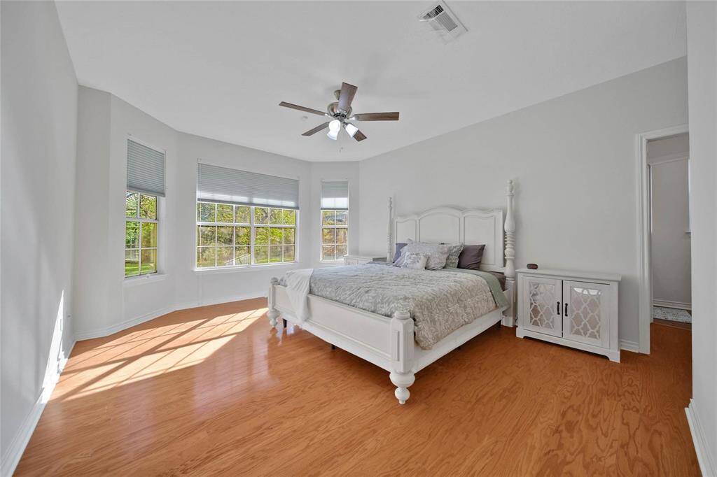 Primary bedroom with gorgeous bay windows.