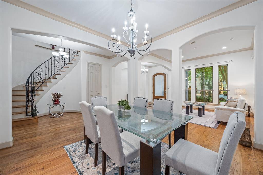 Sensational winding staircase featureing wrought iron and solid wood planked stairs