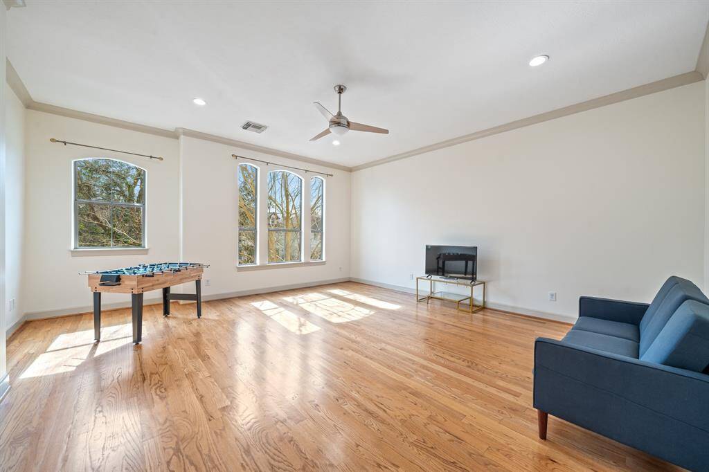 Game Room has an arched entry accessed from the second floor landing