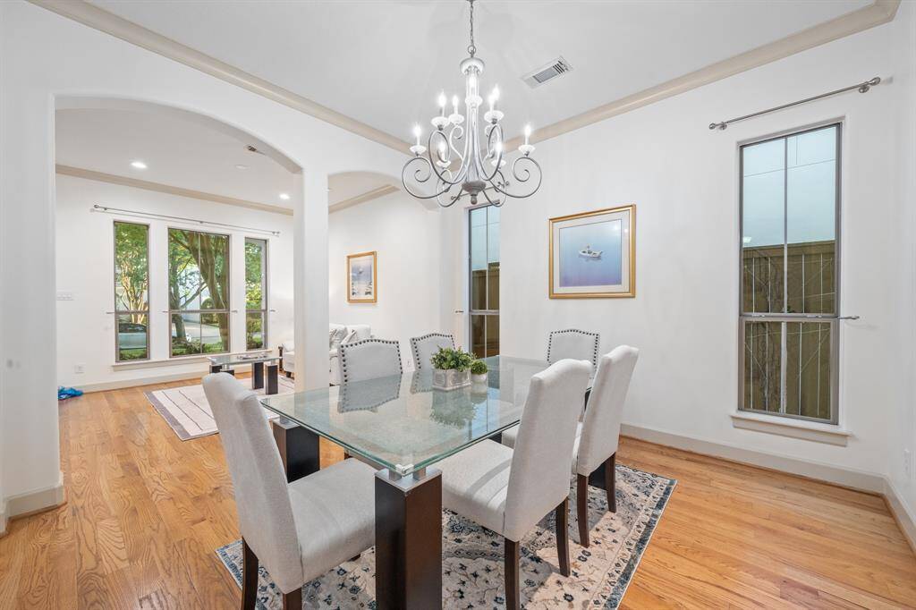 Dining Room features a stylish chandelier and crown molding