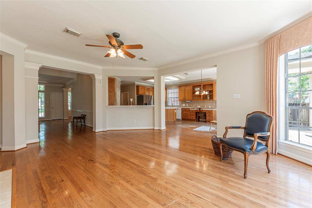 Another view of the living room open to the kitchen and breakfast areas.
