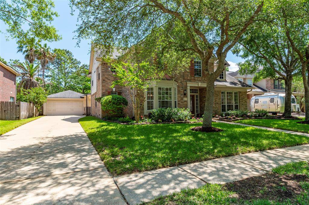 Home is situated on large lot with driveway extending back to the oversized 2 car detached garage.
