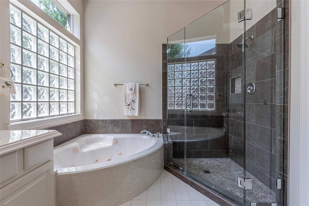 Jetted tub and gorgeous walk in shower.