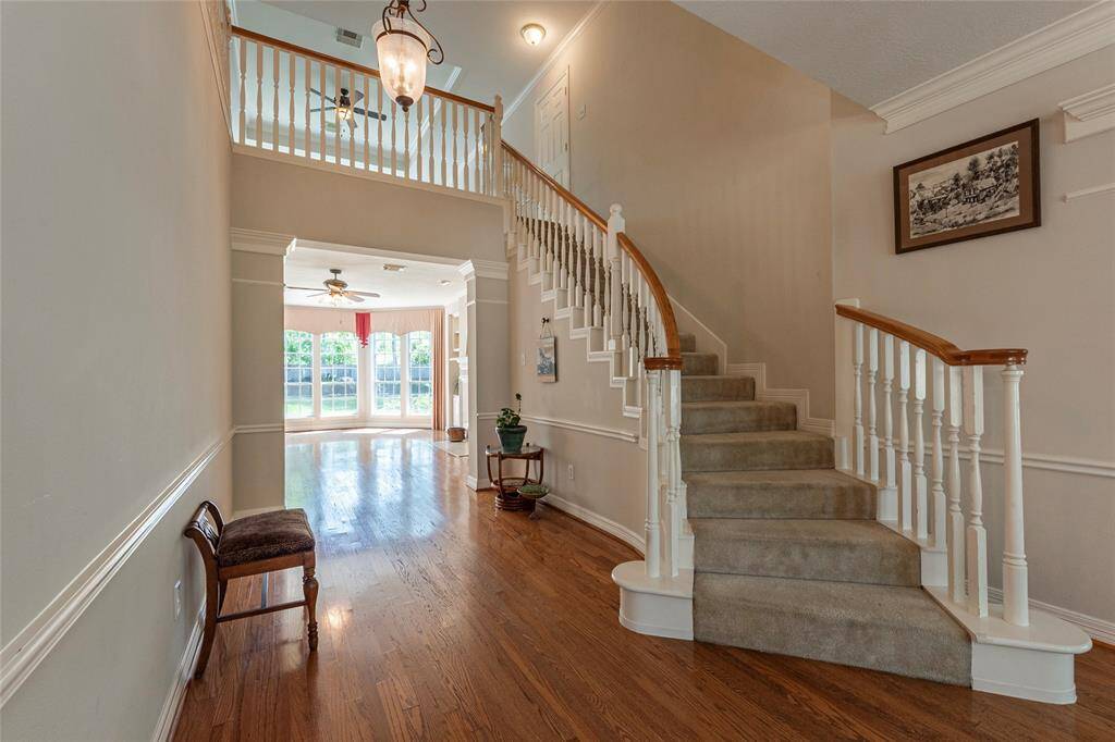 Curved stair case leads up to the spacious 2nd level.
