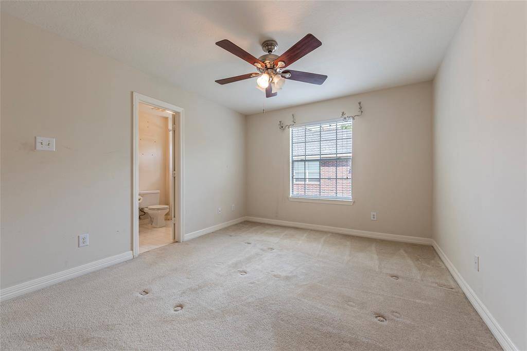Spare bedroom is spacious with access to a full sized bath.
