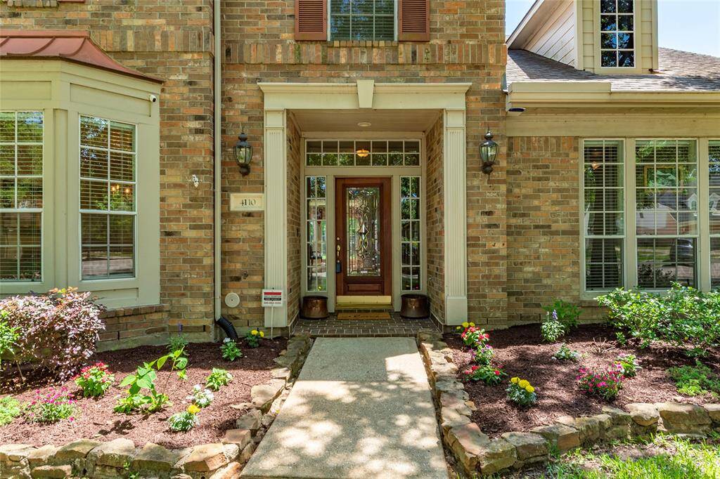 Landscaping on either side of the walkway to the front entry.
