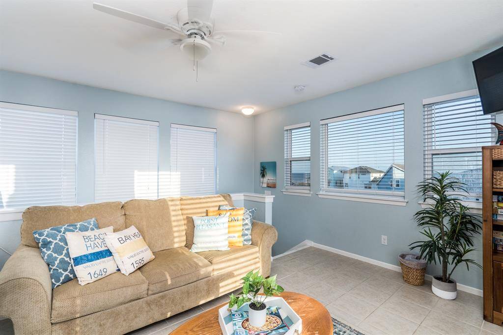 With a pull-out sofa bed, the third-floor flex room easily transforms into a restful guest space or a peaceful spot to unwind with a favorite book.