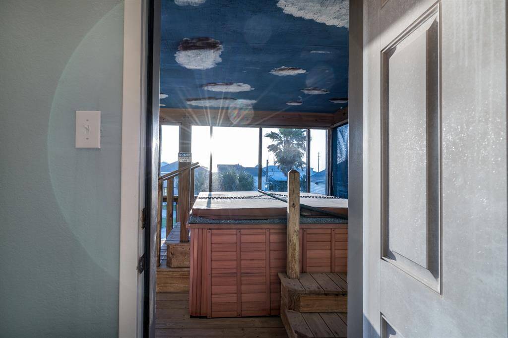 Directly outside the primary bath, the inviting spa awaits, creating the perfect retreat for unwinding and enjoying peaceful moments.