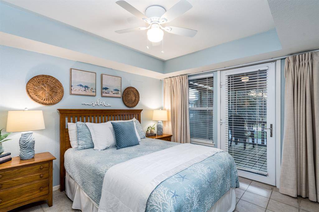 Your guests will feel right at home in this first-floor bedroom featuring convenient full bath access and direct entry to a spacious balcony retreat.