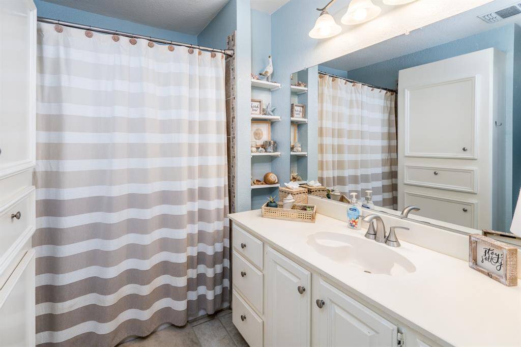 Designed with families in mind, this first-floor full bath includes a soaking tub ideal for bathing the littlest members of the household.