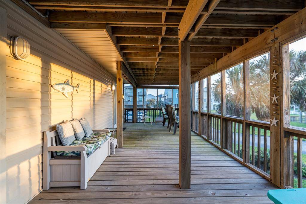 Another perspective of the expansive first-floor screened-in balcony, showcasing just how much room there is to relax, entertain, and enjoy the fresh air in comfort.