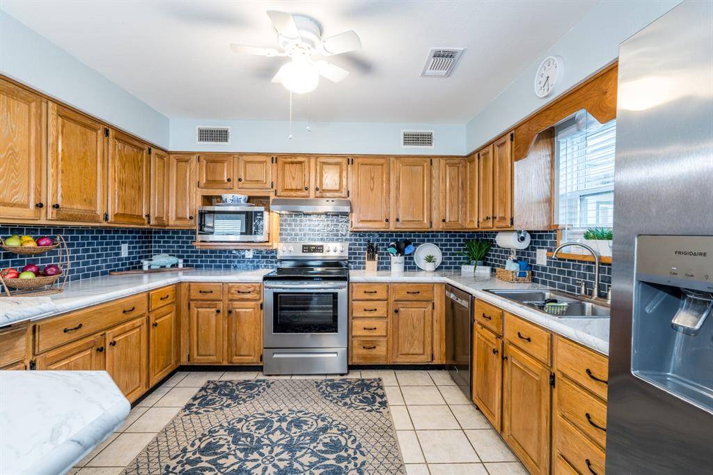 Designed with both style and function in mind, the open kitchen features generous countertops and ample cabinetry to meet all your culinary needs.