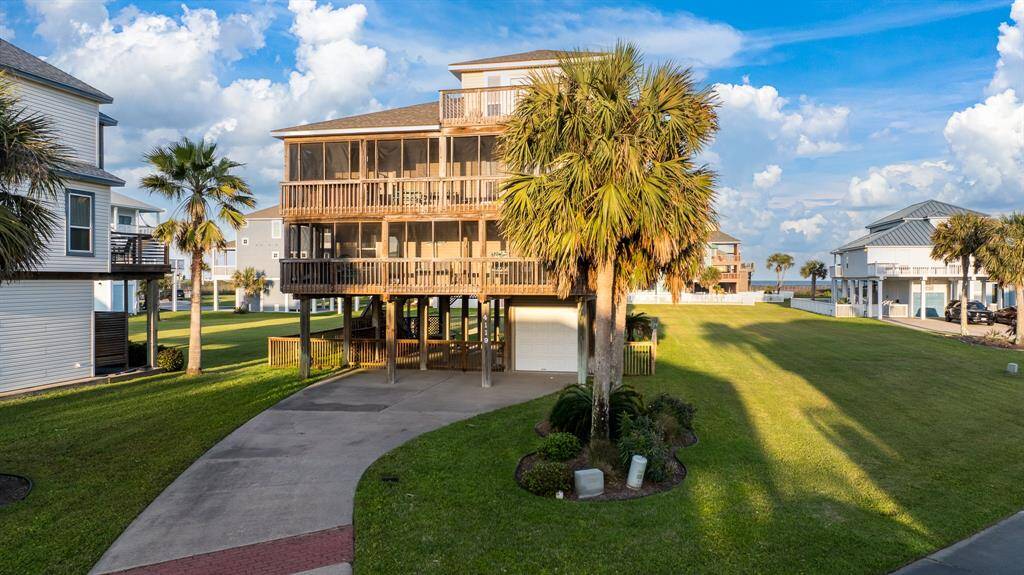 Enjoy a huge covered living area on the ground floor, featuring an outdoor shower for after-swim refreshment and easy access to the garage for added convenience.
