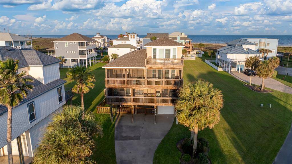 Experience the perfect blend of indoor and outdoor living with expansive screened-in porches and a third-floor balcony offering breathtaking views of the Gulf of America.