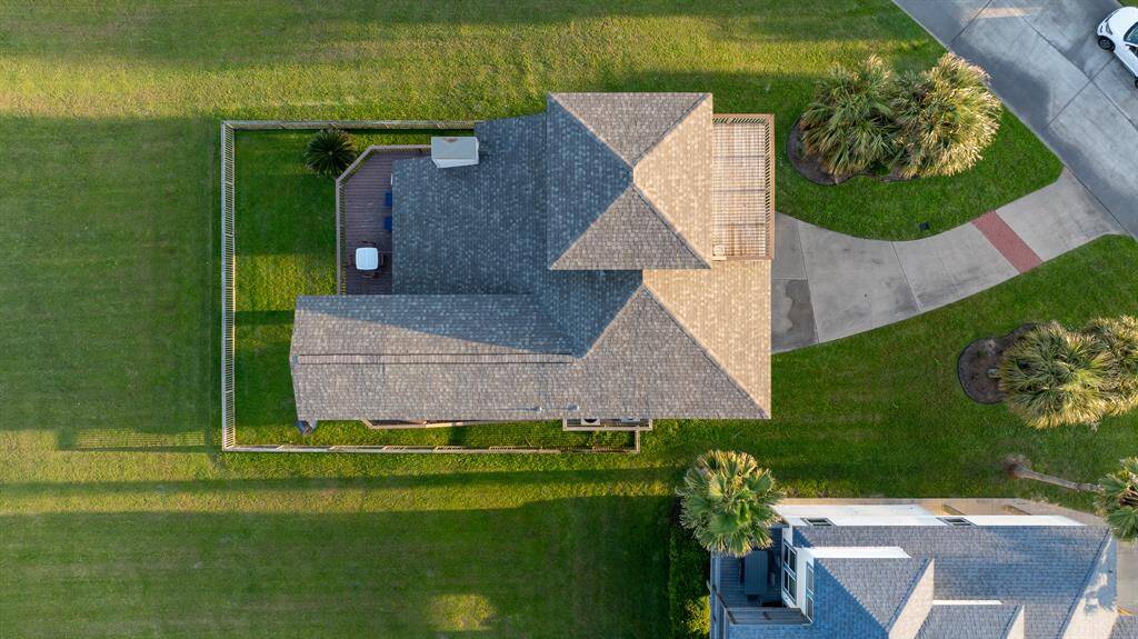 Aerial View – Sweeping bird’s-eye perspective of this expansive beach property showcasing its full scale and surrounding natural beauty.