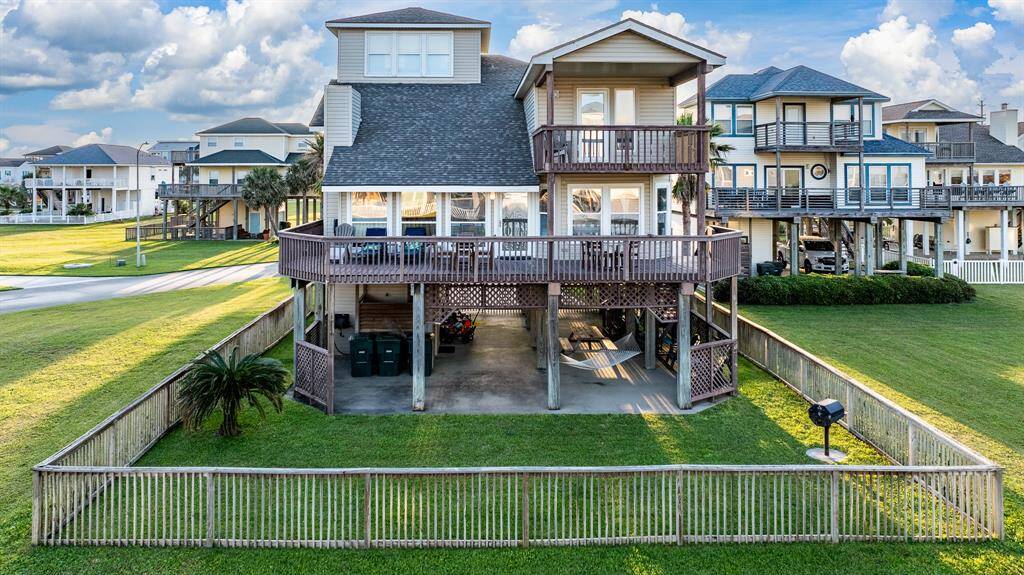 Ground-floor living paired with spacious balconies on both upper levels, all overlooking the sparkling ocean.