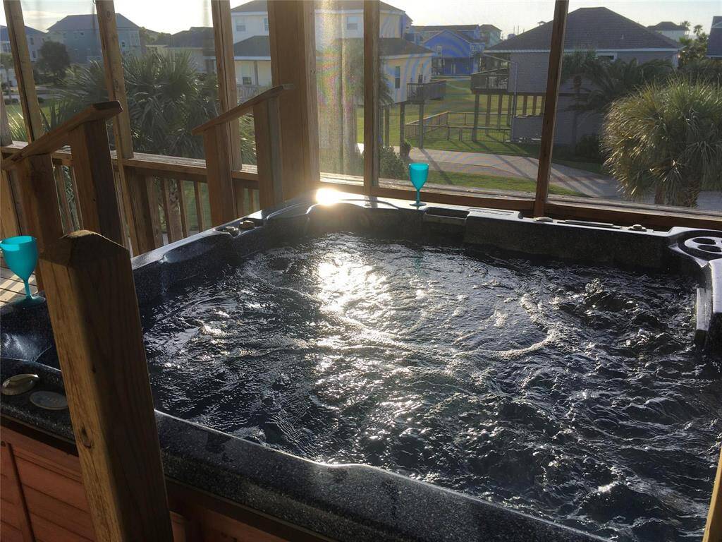 Soak in the hot tub on the second-story balcony located off the primary bedroom as golden sunsets paint the sky—an unforgettable way to end the day.