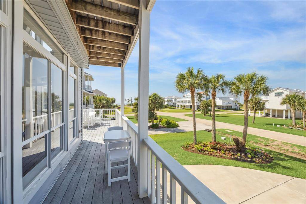 First floor deck located just in front of the dining room, offering beautiful ocean views and a perfect spot for outdoor dining or relaxing.