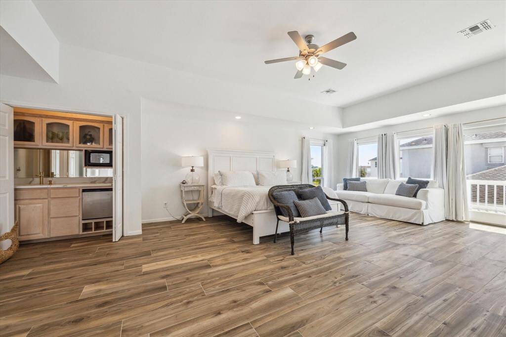 The spacious primary bedroom is located on the 2nd floor and features a convenient breakfast bar complete with a fridge and microwave for comfort and functionality.  Step out onto the private deck and take in the stunning ocean views.