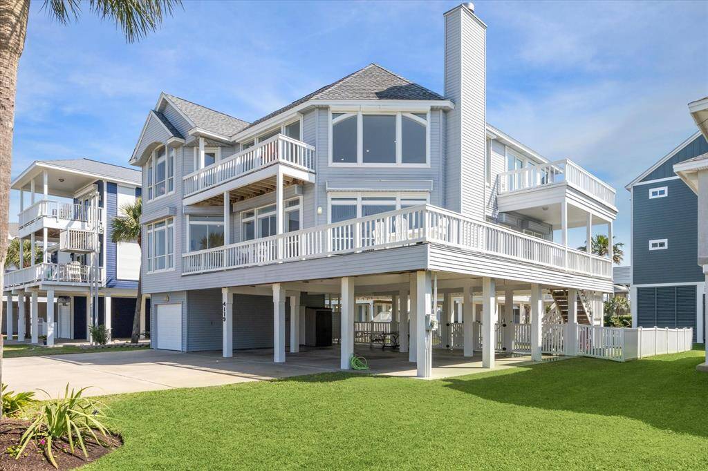 The wrap around deck provides an extension of the home for entertaining or relaxing in the beautiful sun.  The wide driveway allows for additional guest parking.