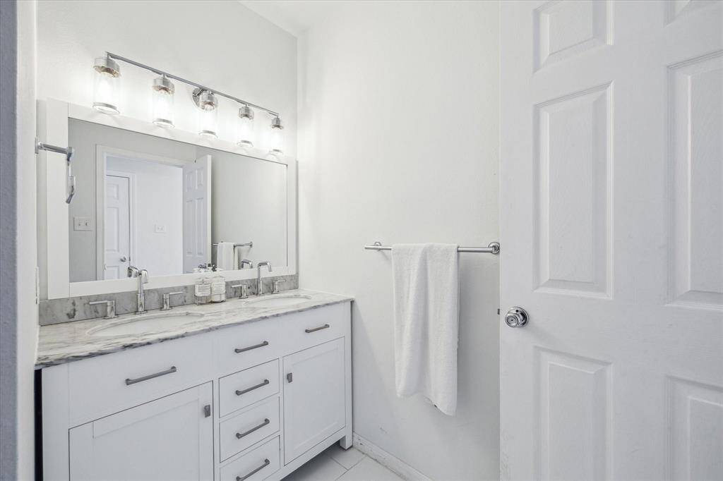 This bathroom services one of the secondary bedrooms on the first floor.