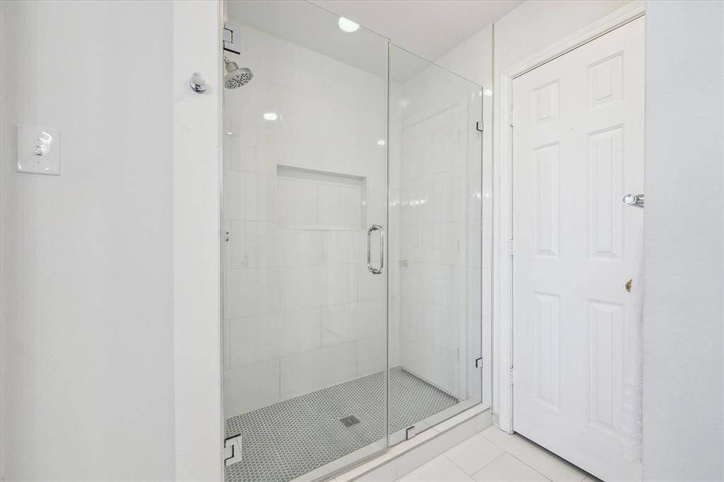 Large updated shower for the secondary bedrooms on the first floor.